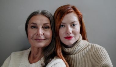 Two women stare into camera